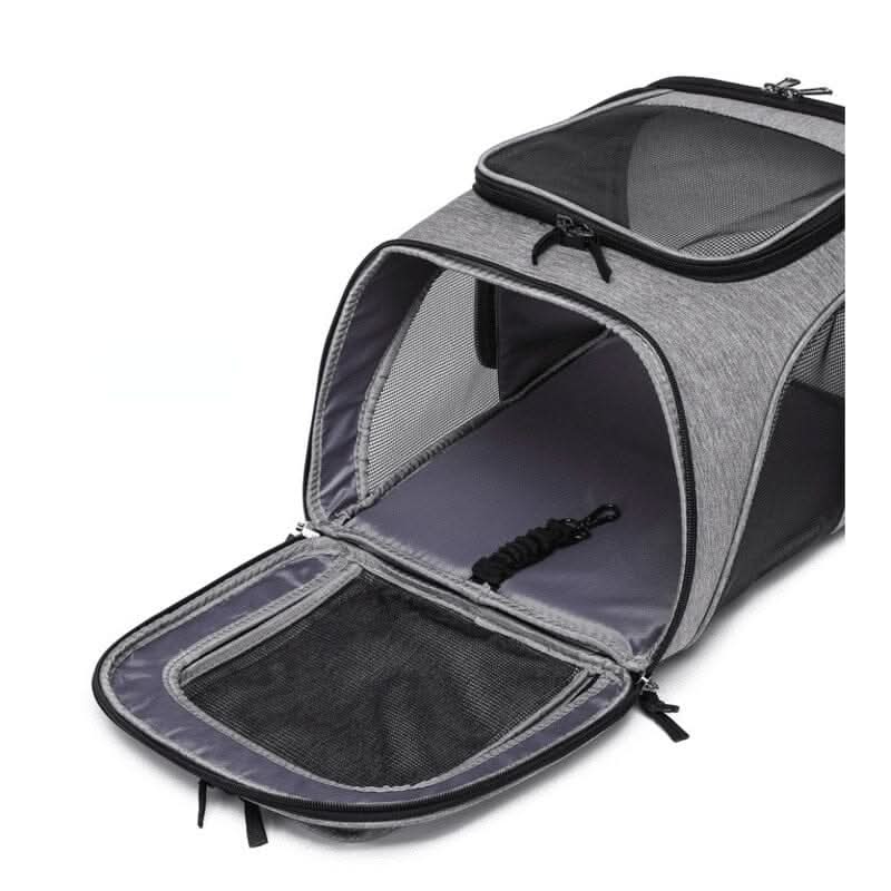 Detalhe da alça reforçada e zíper resistente da bolsa de transporte para gatos