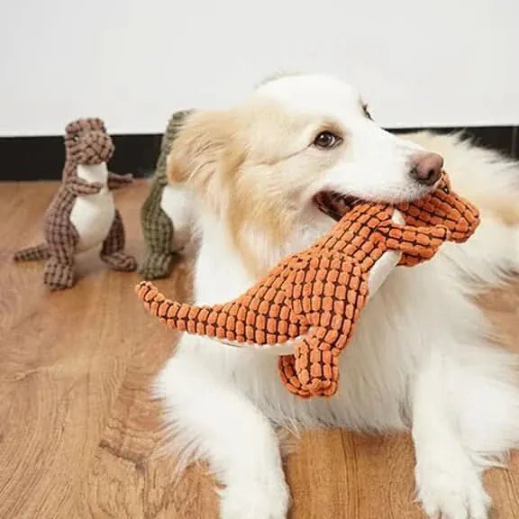 Brinquedo de pelúcia Dino para cães em cor verde com textura macia, ideal para morder