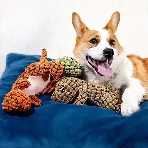 Detalhe do apito embutido no brinquedo de pelúcia para cães formato dinossauro