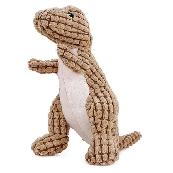 Cachorro segurando brinquedo de pelúcia Dino com apito, promovendo diversão e estímulo mental Madrupet