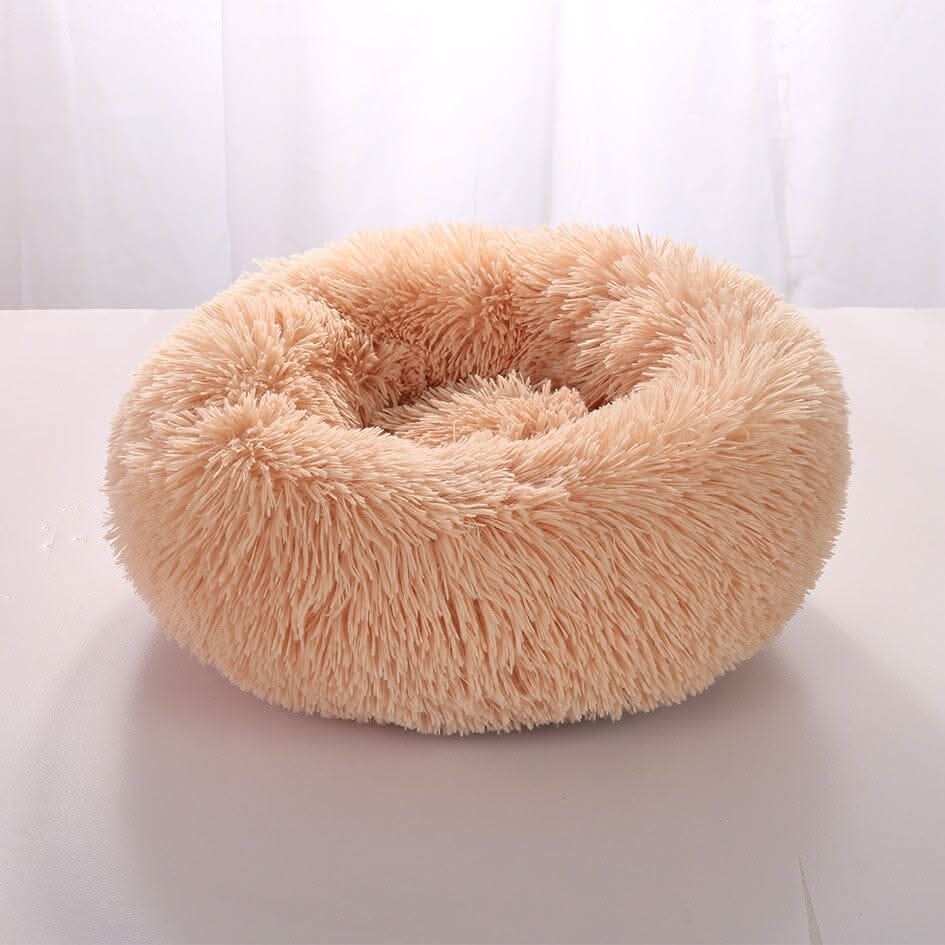 Detalhe do enchimento interno da cama nuvem para cães e gatos, proporcionando suporte macio