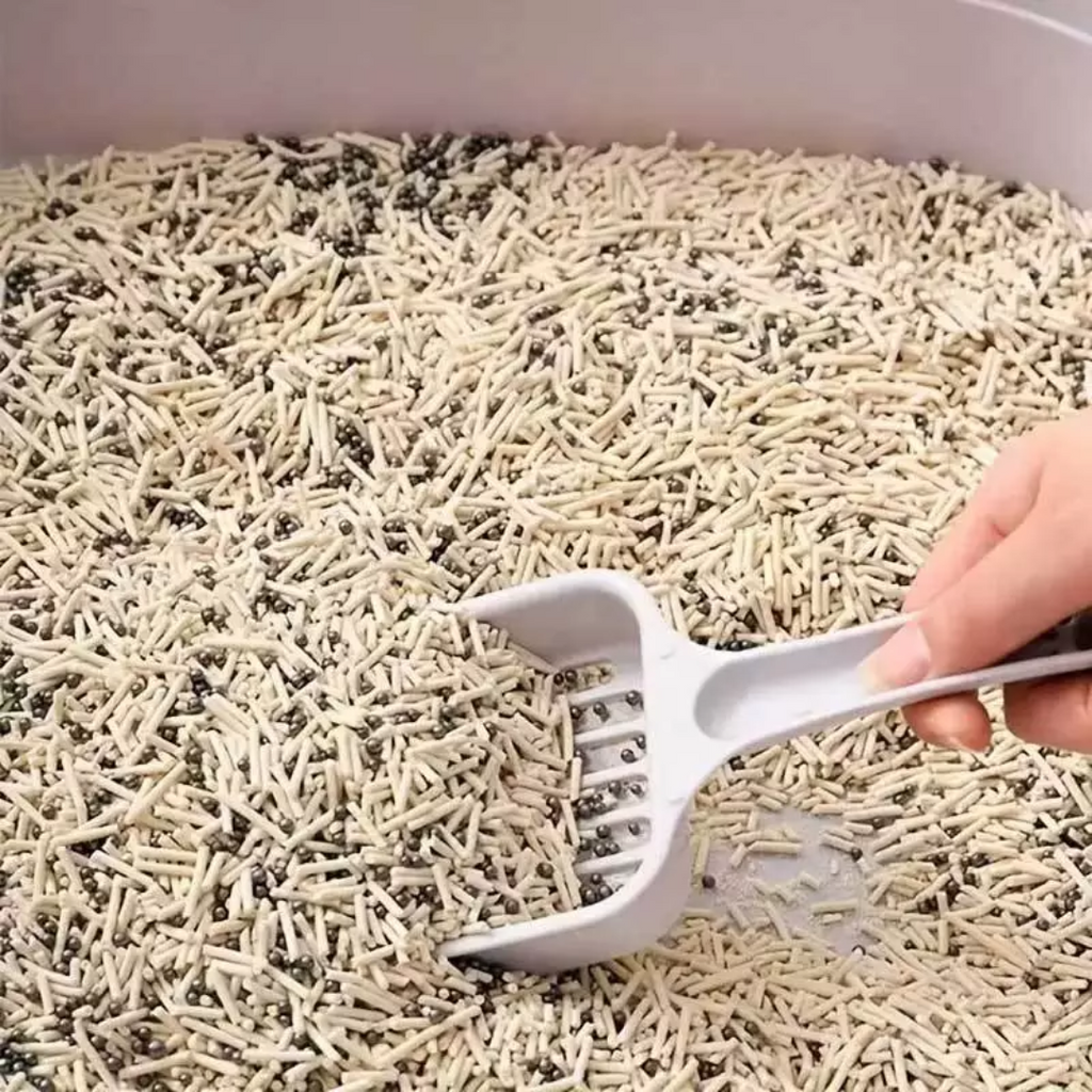 Detalhe do aplicador do neutralizador de cheiros para caixa de areia de gatos